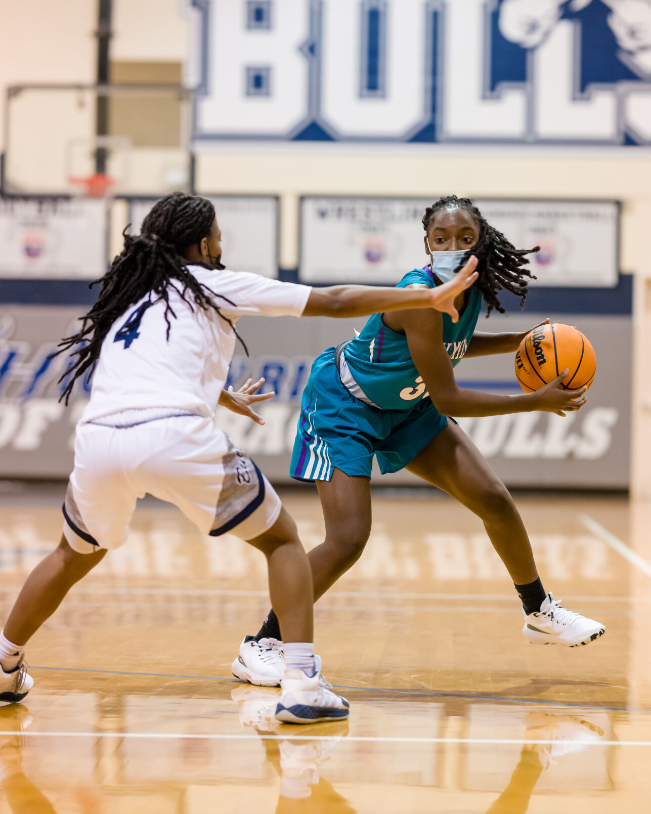 Girls Basketball: Hickory Ridge RaginÕ Bulls defeated the Cox Mill Chargers 60-54 in overtime.